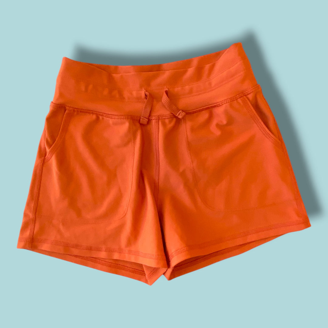 orange Old Navy shorts, 8y